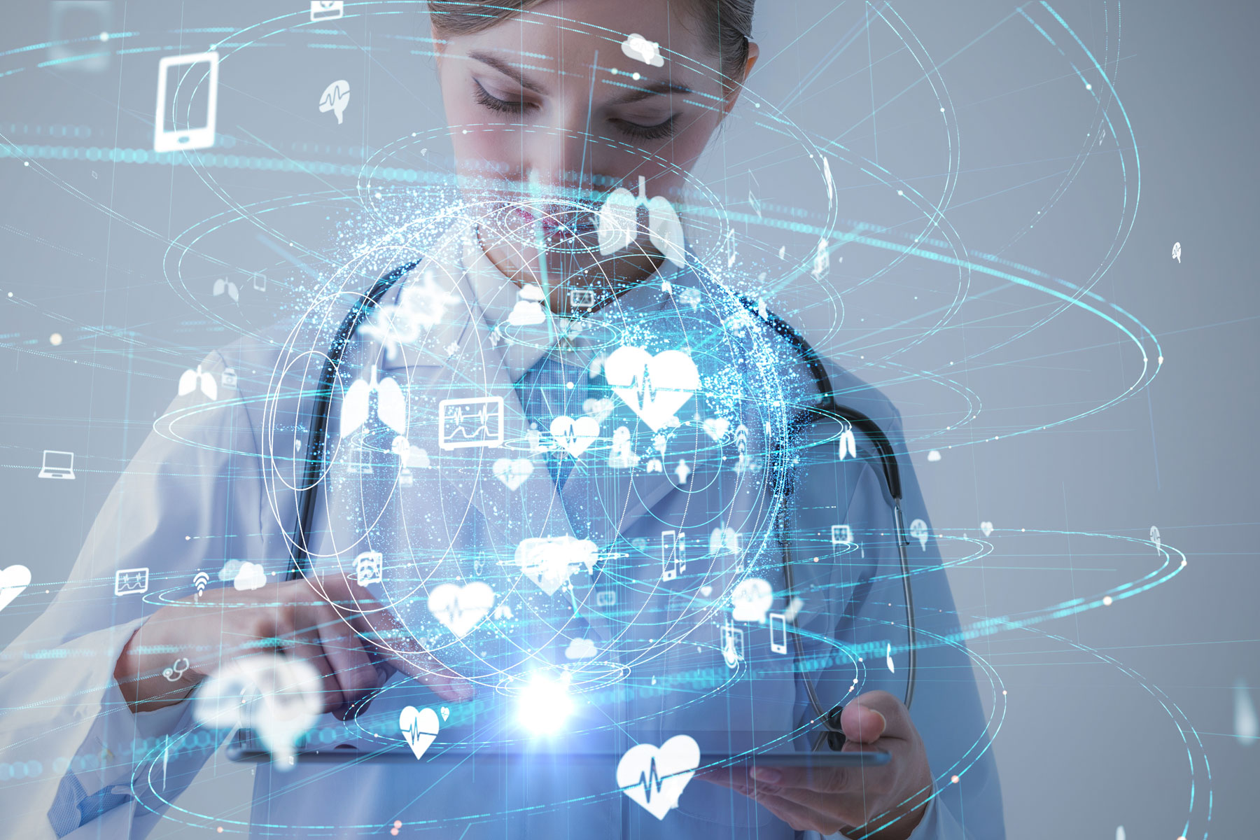 an display of how AI is used in elctronic medical records is superimposed on the image of a healtchare professional working on a tablet comptuer.