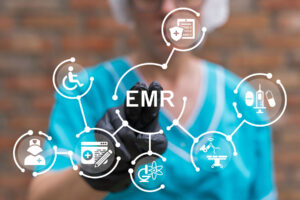 image of a diagram of an EMR system overlaying a blurred image of a healthcare worker as a reminder of how to use EMR systems in healthcare