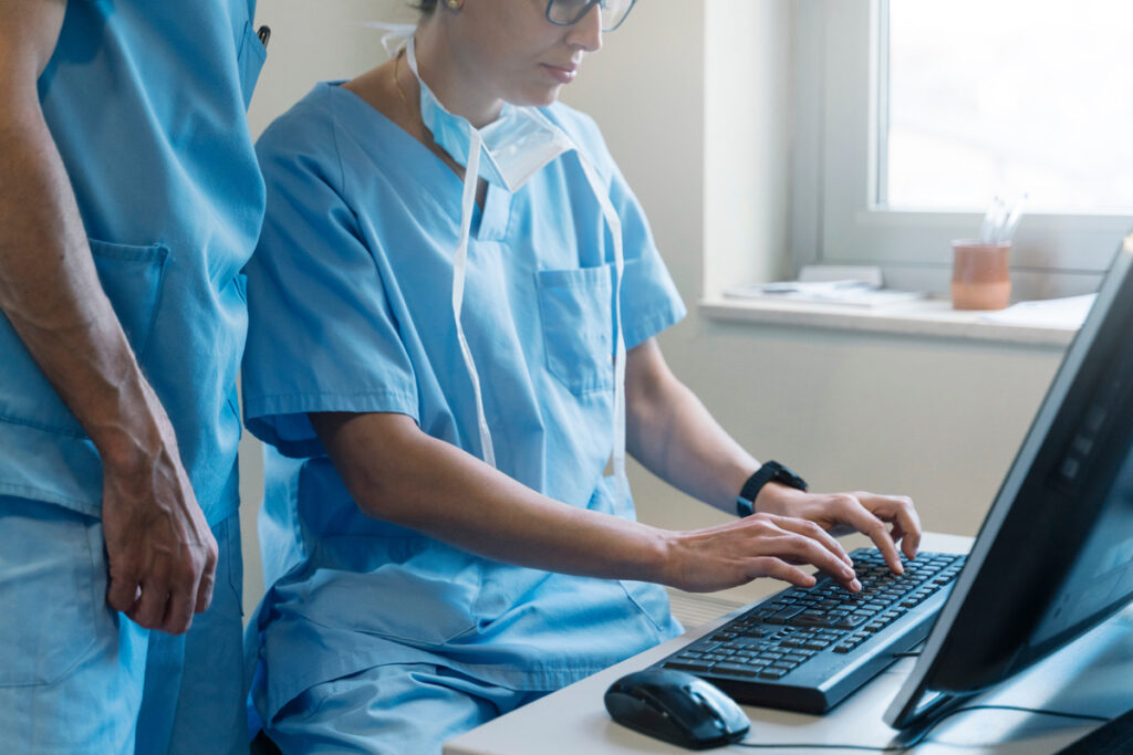 Nurses using desktop PC